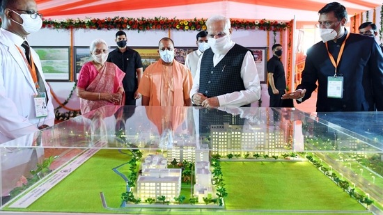 Prime Minister Narendra Modi looking at a model during his visit to a photo exhibition, in Siddharthnagar. (ANI)