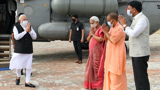 Prime Minister Narendra Modi being welcomed by the Governor of Uttar Pradesh Anandiben Patel, Union Minister for Health and Family Welfare, Chemicals and Fertilizers Mansukh Mandaviya, and Chief Minister Yogi Adityanath, on his arrival, at Kashi, in Varanasi.(ANI )