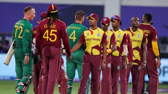 AP10 26 2021 000214A 0 1635257072803 1635257142026 West Indies players, right, congratulate South Africa's Rassie van der Dussen, left, and Aiden Markram following their Twenty20 World Cup in Dubai.(AP)