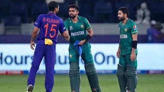 India's Bhuvneshwar Kumar congratulates Pakistan's cricket captain Babar Azam, centre and Mohammad Rizwan after Pakistan won the Cricket Twenty20 World Cup match between India and Pakistan in Dubai,(AP) India's Bhuvneshwar Kumar congratulates Pakistan's cricket captain Babar Azam, centre and Mohammad Rizwan after Pakistan won the Cricket Twenty20 World Cup match between India and Pakistan in Dubai,(AP)