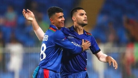 Afghanistan's Naveen-ul-Haq, right, celebrates the dismissal of Scotland's Matthew Cross during the Twenty20 World Cup match between Afghanistan and Scotland in Sharjah.(AP) Afghanistan's Naveen-ul-Haq, right, celebrates the dismissal of Scotland's Matthew Cross during the Twenty20 World Cup match between Afghanistan and Scotland in Sharjah.(AP)