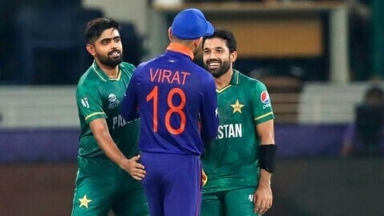 Indian cricket captain Virat Kohli congratulates Pakistan's Mohammad Rizwan, right, and Babar Azam after Pakistan won the Cricket Twenty20 World Cup match between India and Pakistan in Dubai(AP) Indian cricket captain Virat Kohli congratulates Pakistan's Mohammad Rizwan, right, and Babar Azam after Pakistan won the Cricket Twenty20 World Cup match between India and Pakistan in Dubai(AP)