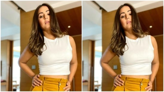She teamed it with a contrasting pair of high-waisted ochre trousers.(Instagram/@realhinakhan)