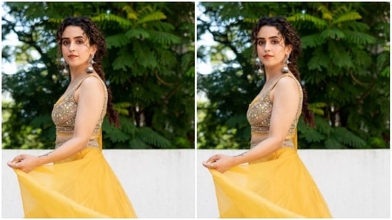 Sanya picked the ensemble from the wardrobe of fashion designer Ridhima Bhasin. The lehenga blouse is embedded with silver mini mirrors.(Instagram/@sanyamalhotra_)