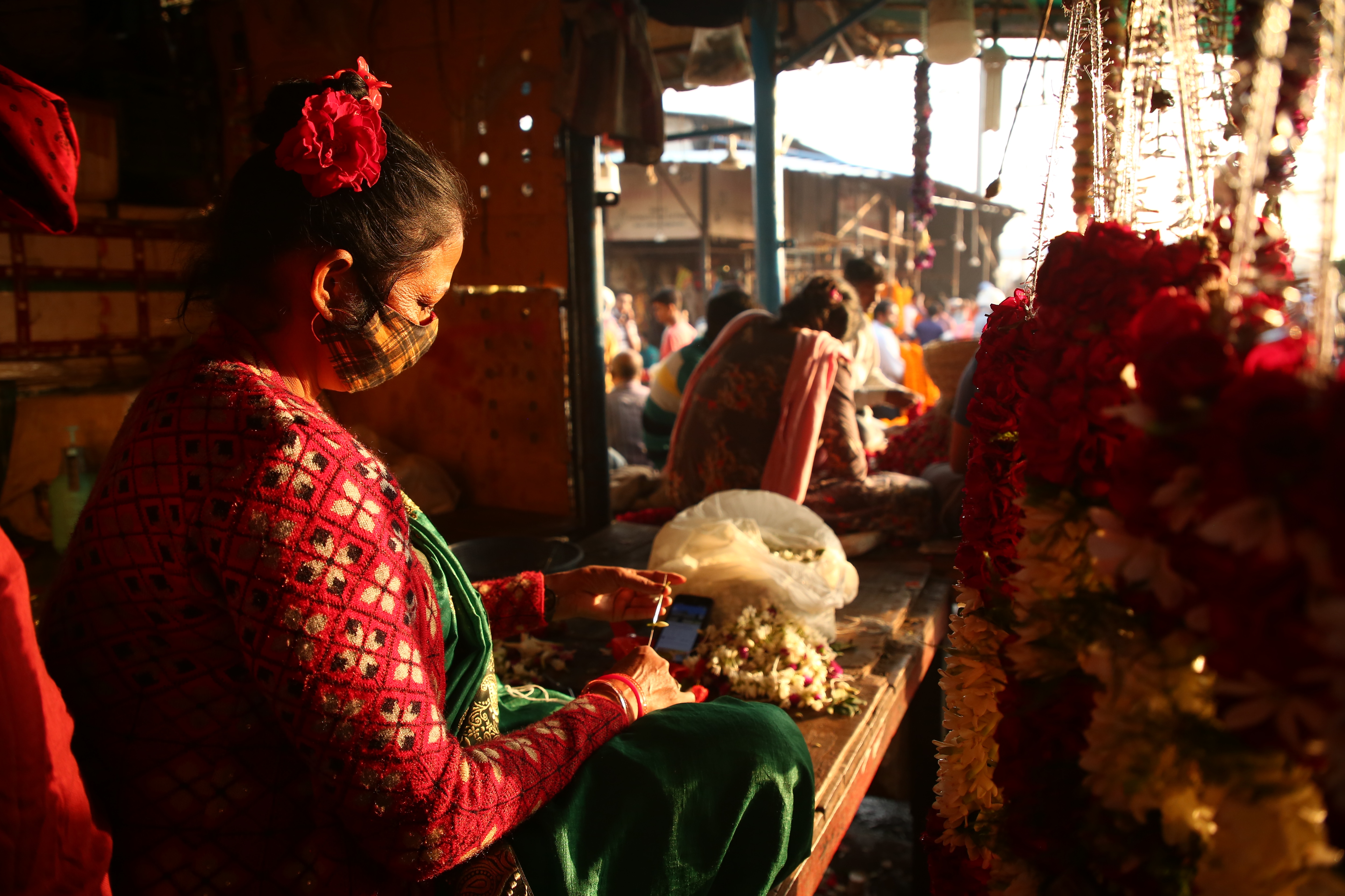 The women at the market begin weaving jaimalas from as early as 4am. Jaimalas start from ₹350/pair and go upto ₹10,000/pair. (Photo: Raajessh Kashyap/HT) The women at the market begin weaving jaimalas from as early as 4am. Jaimalas start from ₹350/pair and go upto ₹10,000/pair. (Photo: Raajessh Kashyap/HT)