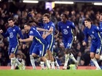 Chelsea players celebrate after winning the penalty shoot-out