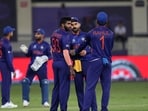 Indian cricket captain Virat Kohli talks to teammates during the last few overs of the Cricket Twenty20 World Cup match between India and Pakistan in Dubai, UAE.(AP)