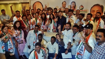 22 BJP corporators in the Ulhasnagar Municipal Corporation including Pancham Omi Kalani join Nationalist Congress Party (NCP) in the presence of Housing Minister Jitendra Awhad at Tip Top Plaza hall, in Thane, Mumbai. (Praful Gangurde/HT Photo) 22 BJP corporators in the Ulhasnagar Municipal Corporation including Pancham Omi Kalani join Nationalist Congress Party (NCP) in the presence of Housing Minister Jitendra Awhad at Tip Top Plaza hall, in Thane, Mumbai. (Praful Gangurde/HT Photo)