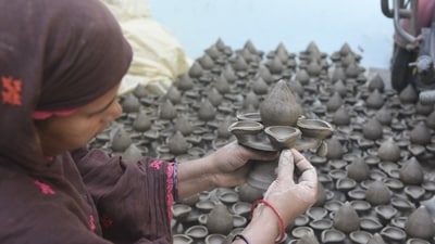 The family consists of 30 members including children who work together to prepare earthen lamps ahead of the most awaited Hindu festival, Diwali. (HT Photo/Deepak Gupta)