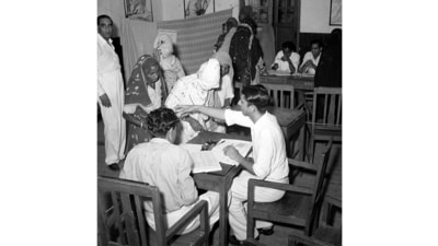 Women voters from villages being given instructions before casting their votes during the mock election in Nangloi near Delhi on September 2, 1951. (Courtesy Photo Division, PIB)