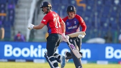 England's Dawid Malan, left, and teammate Jason Roy run between the wickets during the Cricket Twenty20 World Cup match between England and Bangladesh in Abu Dhabi, UAE, Wednesday, Oct. 27, 2021. (AP Photo/Aijaz Rahi) (AP) England's Dawid Malan, left, and teammate Jason Roy run between the wickets during the Cricket Twenty20 World Cup match between England and Bangladesh in Abu Dhabi, UAE, Wednesday, Oct. 27, 2021. (AP Photo/Aijaz Rahi) (AP)