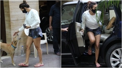 Malaika completed the ensemble with a pair of flip flops, a black printed facemask, and her tresses tied in a sleek top knot. (HT Photo/Varinder Chawla) Malaika completed the ensemble with a pair of flip flops, a black printed facemask, and her tresses tied in a sleek top knot. (HT Photo/Varinder Chawla)