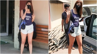 On the other hand, Pooja Hegde flaunted her love for Pilates by wearing a dark blue tank top with 'Pilates Girl' written on it. The star teamed the top with a pair of white shorts and matching chunky lace-up sneakers. (HT Photo/Varinder Chawla) On the other hand, Pooja Hegde flaunted her love for Pilates by wearing a dark blue tank top with 'Pilates Girl' written on it. The star teamed the top with a pair of white shorts and matching chunky lace-up sneakers. (HT Photo/Varinder Chawla)
