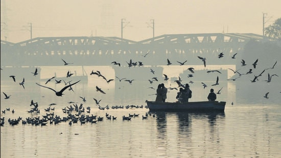 A haze over the Yamuna river during sunrise on Wednesday. (PTI) A haze over the Yamuna river during sunrise on Wednesday. (PTI)
