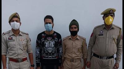 The accused arrested from Kishtwar with firearm in Jammu and Kashmir Police custody on Thursday. (HT Photo) The accused arrested from Kishtwar with firearm in Jammu and Kashmir Police custody on Thursday. (HT Photo)