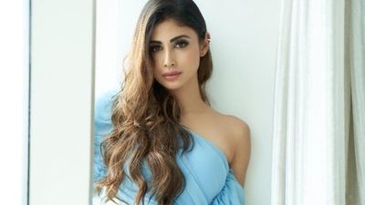 Mouni recently turned cover girl for a magazine and was seen dolled up for their photoshoot in a sky blue Tulum mini dress that came with a one-sided sleeve which was finely draped and sported an exaggerated fringe detail. (Instagram/imouniroy) Mouni recently turned cover girl for a magazine and was seen dolled up for their photoshoot in a sky blue Tulum mini dress that came with a one-sided sleeve which was finely draped and sported an exaggerated fringe detail. (Instagram/imouniroy)
