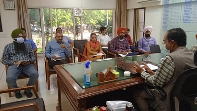 Deputy commissioner Varinder Kumar Sharma holding a meeting regarding paddy procurement in the district at his office in Ludhiana on Thursday. (HT photo)