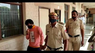 Nishu Phogat, one of the convicts in the Haryana CBSE topper gangrape case of 2018, being escorted out of the fast-track court in Narnaul town of Mahendragarh district on Thursday. (HT Phpto) Nishu Phogat, one of the convicts in the Haryana CBSE topper gangrape case of 2018, being escorted out of the fast-track court in Narnaul town of Mahendragarh district on Thursday. (HT Phpto)