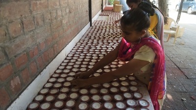 Visually impaired girls prepare wax filled earthen lamps ahead of the upcoming Diwali or Festival of Lights, at a centre for visually impaired girls in Ahmedabad. (AFP) Visually impaired girls prepare wax filled earthen lamps ahead of the upcoming Diwali or Festival of Lights, at a centre for visually impaired girls in Ahmedabad. (AFP)