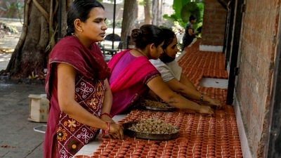 Visually impaired girls make earthen lamps for the upcoming Diwali festival, inside Andh Kanya Prakash Gruh in Ahmedabad. (PTI) Visually impaired girls make earthen lamps for the upcoming Diwali festival, inside Andh Kanya Prakash Gruh in Ahmedabad. (PTI)