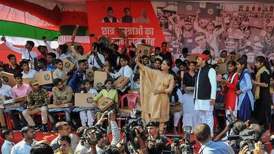 Samajwadi Party chief Akhilesh Yadav poses for a photograph with meritorious students after distributing laptops in Azamgarh on Thursday. (PTI Photo) Samajwadi Party chief Akhilesh Yadav poses for a photograph with meritorious students after distributing laptops in Azamgarh on Thursday. (PTI Photo)