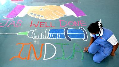 A person makes a rangoli in Bengaluru, Karnataka. A school in the state was shut after 33 students tested positive for Covid-19. (ANI/File) A person makes a rangoli in Bengaluru, Karnataka. A school in the state was shut after 33 students tested positive for Covid-19. (ANI/File)