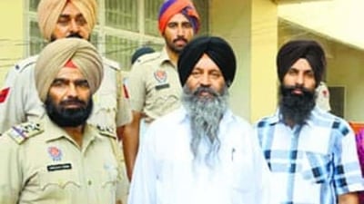 Convicted SGPC member and former militant Kulbir Singh Barapind (centre) in police custody in Jalandhar on Wednesday. (HT Photo) Convicted SGPC member and former militant Kulbir Singh Barapind (centre) in police custody in Jalandhar on Wednesday. (HT Photo)