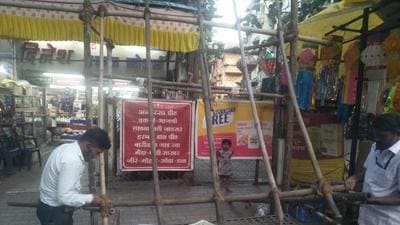 An illegal firecracker stall is dismantled by the PMC on Thursday. PMC takes action against 23 illegal firecracker stalls in Pune. (HT) An illegal firecracker stall is dismantled by the PMC on Thursday. PMC takes action against 23 illegal firecracker stalls in Pune. (HT)