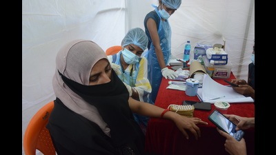 A beneficiary gets vaccinated in Mumbra as part of Thane Municipal Corporation’s drive on Thursday. TMC has started door-to-door survey to understand how many people have been vaccinated. (PRAFUL GANGURDE/HT PHOTO)
