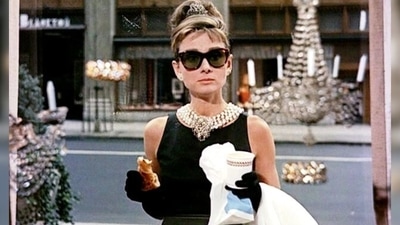 Holly Golightly from Breakfast at Tiffany's: You do not need to put in much efforts into this one. All you need to do is pick a black dress from your wardrobe and accessorise it with a pearl necklace, gloves and a pair of black shades. (Movie screengrab) Holly Golightly from Breakfast at Tiffany's: You do not need to put in much efforts into this one. All you need to do is pick a black dress from your wardrobe and accessorise it with a pearl necklace, gloves and a pair of black shades. (Movie screengrab)