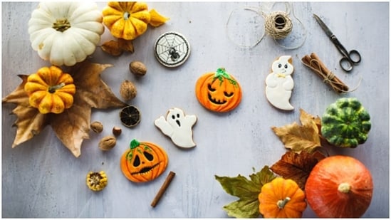 You can also go crazy creative on food.  In fact, one of the most important ways to celebrate Halloween is by using pumpkins.  Why not dress up your cookies to give a horrible vibe and put colorful pumpkins around and have a spooky conversation with your friends around.  (https://unsplash.com/)