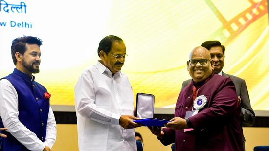 New Delhi: Vice President M Venkaiah Naidu presents an award to film director and actor Satish Kaushik at the 67th National Film Awards presentation ceremony, at Vigyan Bhawan in New Delhi, Monday, Oct. 25, 2021 (PTI)