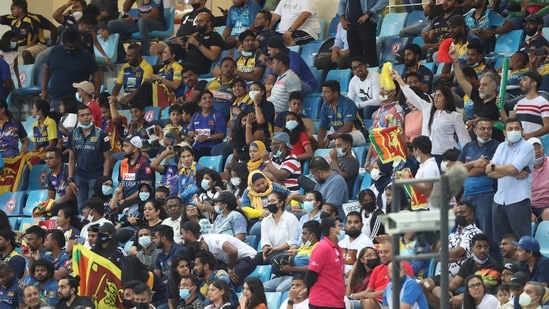 Sri Lanka supporters cheer their team during the Cricket Twenty20 World Cup match between Australia and Sri Lanka in Dubai, UAE, Thursday, Oct. 28, 2021. (AP Photo/Aijaz Rahi)(AP)