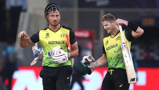 Australia's Marcus Stoinis, left, and Steven Smith celebrate their team win against Sri Lanka during the Cricket Twenty20 World Cup match in Dubai, UAE, Thursday, Oct. 28, 2021. (AP Photo/Aijaz Rahi)(AP)