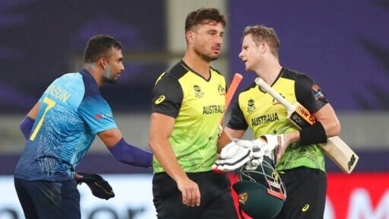 Sri Lanka's captain Dasun Shanaka, left, congratulates Australia's Steven Smith, right, on their win during the Cricket Twenty20 World Cup match in Dubai, UAE, Thursday, Oct. 28, 2021. (AP Photo/Aijaz Rahi)(AP)
