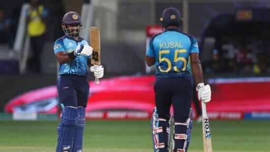Sri Lanka's Charith Asalanka, left, applauds after his teammate Sri Lanka's Kusal Perera hits a boundary during the Cricket Twenty20 World Cup match between Australia and Sri Lanka in Dubai, UAE, Thursday, Oct. 28, 2021.(AP Photo/Aijaz Rahi)(AP)