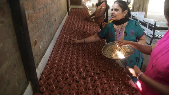 On Diwali, which will be observed on November 4 this year, people light their houses with earthen lamps and candles, worship Goddess Lakshmi, exchange sweets and gifts and spend time with their family.(AFP)