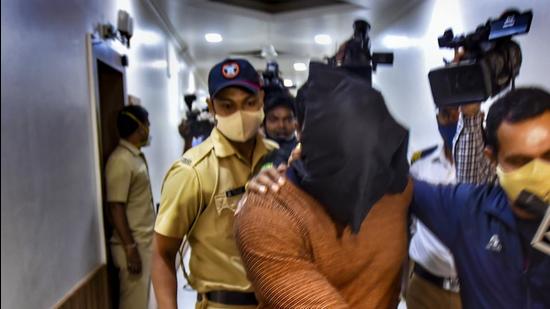 Kiran Gosavi, the NCB witness in the Mumbai drugs-on-cruise case, at the Commissioner of Police office in Pune on Thursday. (PTI) Kiran Gosavi, the NCB witness in the Mumbai drugs-on-cruise case, at the Commissioner of Police office in Pune on Thursday. (PTI)