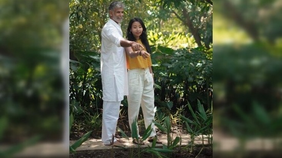 Milind Soman and Ankita Konwar appreciate the organic garden as they take a walk outdoors in their resort.(Instagram/@milindrunning)