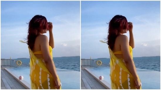 Tahira, in a yellow bikini, let her hair play to the tunes of the wind in Maldives.(Instagram/@tahirakashyap)