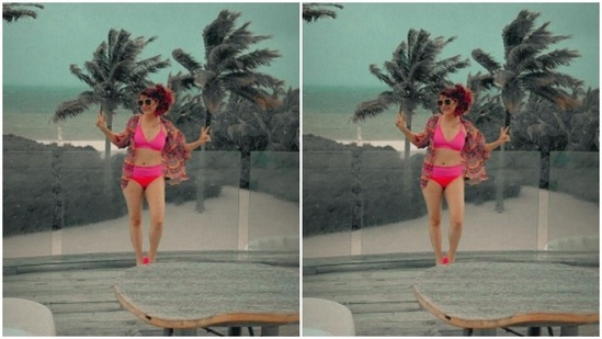 Tahira, in a pink bikini and a printed shrug, posed by the deck.(Instagram/@tahirakashyap)