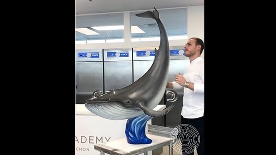 Amaury Guichon with the finished 90 pound chocolate whale. (instagram/@amauryguichon) Amaury Guichon with the finished 90 pound chocolate whale. (instagram/@amauryguichon)