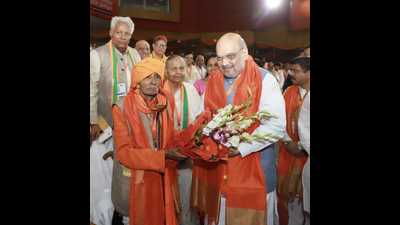 Amit Shah meeting Bhulai Bhai, a party cadre, rumoured to be 107-year-old.