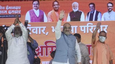 Home minister Amit Shah waves to the crowd in Lucknow, Uttar Pradesh on Friday. (Deepak Gupta/ HT photo) Home minister Amit Shah waves to the crowd in Lucknow, Uttar Pradesh on Friday. (Deepak Gupta/ HT photo)