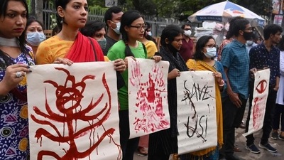 Activists stage a demonstration in Dhaka on October 19, 2021 to protest against the recent deadly religious violence against the Hindu community in Bangladesh. (AFP Photo) Activists stage a demonstration in Dhaka on October 19, 2021 to protest against the recent deadly religious violence against the Hindu community in Bangladesh. (AFP Photo)