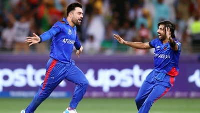 Dubai, Oct 29 (ANI): Rashid Khan of Afghanistan celebrates the wicket of Babar Azam of Pakistan which is later given not out on review during the ICC mens Twenty20 World Cup cricket match between Pakistan and Afghanistan, at Dubai International Cricket Stadium in Dubai on Friday. (ANI) Dubai, Oct 29 (ANI): Rashid Khan of Afghanistan celebrates the wicket of Babar Azam of Pakistan which is later given not out on review during the ICC mens Twenty20 World Cup cricket match between Pakistan and Afghanistan, at Dubai International Cricket Stadium in Dubai on Friday. (ANI)