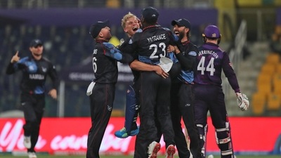 Namibia's Ruben Trumpelmann, without cap, celebrates the dismissal of Scotland's Richie Berrington, right, during the Cricket Twenty20 World Cup match between Namibia and Scotland in Abu Dhabi, UAE, Wednesday, Oct. 27, 2021. (AP) Namibia's Ruben Trumpelmann, without cap, celebrates the dismissal of Scotland's Richie Berrington, right, during the Cricket Twenty20 World Cup match between Namibia and Scotland in Abu Dhabi, UAE, Wednesday, Oct. 27, 2021. (AP)