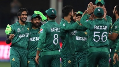 Pakistan's Hasan Ali, left, celebrates with teammates the dismissal of Afghanistan's Karim Janat during the Cricket Twenty20 World Cup match between Pakistan and Afghanistan in Dubai, UAE, Friday, Oct. 29, 2021. (AP Photo/Aijaz Rahi) (AP)