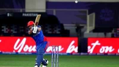 Afghanistan's Gulbadin Naib hits a six during the Cricket Twenty20 World Cup match between Pakistan and Afghanistan in Dubai, UAE, Friday, Oct. 29, 2021. (AP Photo/Aijaz Rahi) (AP)