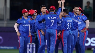 Afghanistan's Mujeeb Ur Rahman, center left without cap, celebrates with teammates the dismissal of Pakistan's Mohammad Rizwan during the Cricket Twenty20 World Cup match between Pakistan and Afghanistan in Dubai, UAE, Friday, Oct. 29, 2021. (AP Photo/Aijaz Rahi) (AP)